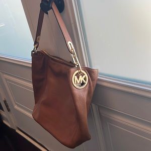 Michael Kors brown leather purse with gold accents